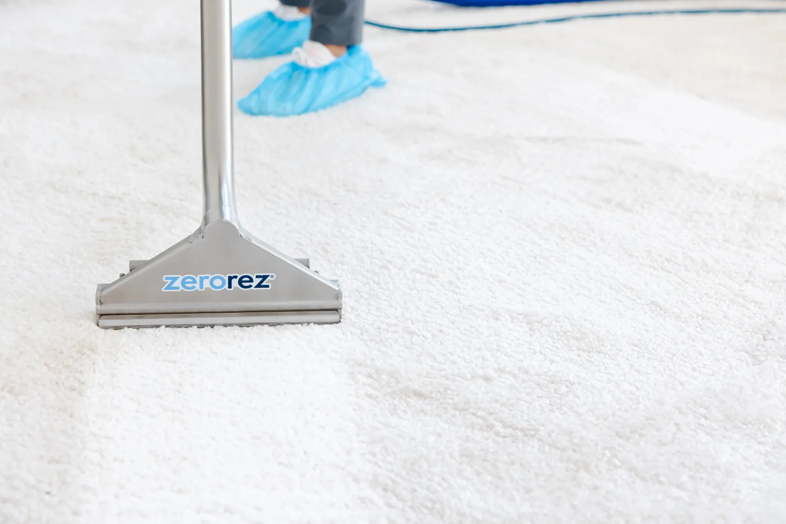 carpet cleaning wand on white carpet